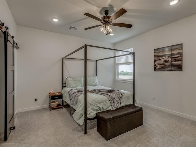 1330 Acclivis Ct, Newcastle, OK 73065 - carpeted bedroom featuring recessed lighting, a barn door, visible vents, and baseboards