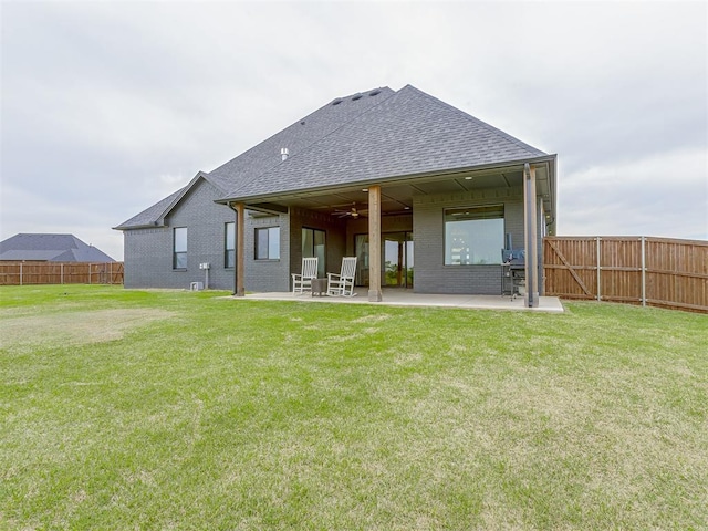 1330 Acclivis Ct, Newcastle, OK 73065 - back of property featuring a patio area, brick siding, and roof with shingles