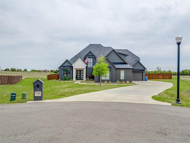 1330 Acclivis Ct, Newcastle, OK 73065 - view of front of house featuring concrete driveway, a front lawn, a standing seam roof, metal roof, and fence