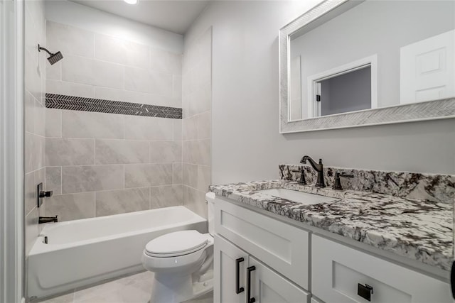 bathroom with toilet, vanity, and shower / bath combination