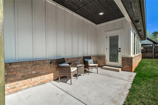 view of patio featuring fence
