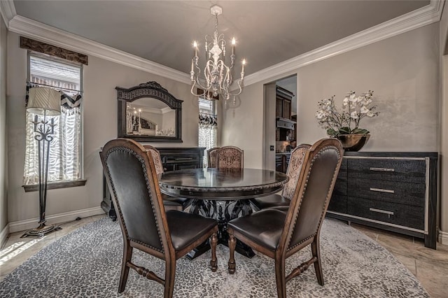 dining area with crown molding, baseboards, and a chandelier