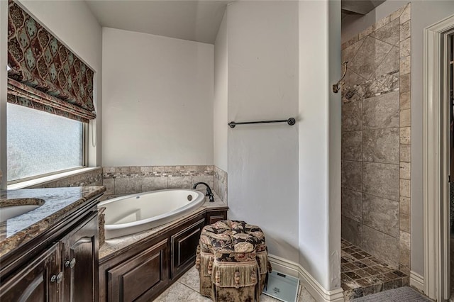 full bath featuring a tile shower, vanity, and a garden tub