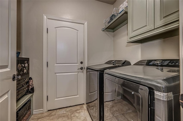 laundry room featuring cabinet space and independent washer and dryer