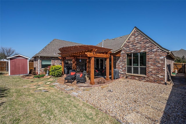 rear view of property featuring a patio, a shingled roof, a pergola, and brick siding