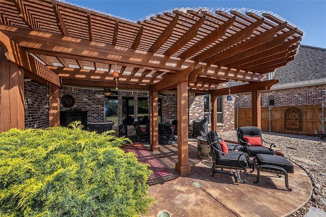 view of patio / terrace featuring fence and a pergola