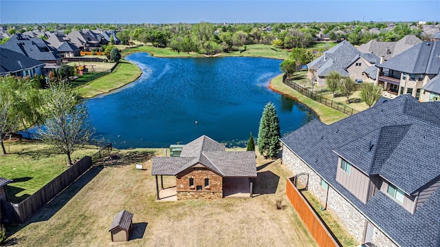 aerial view featuring a water view and a residential view