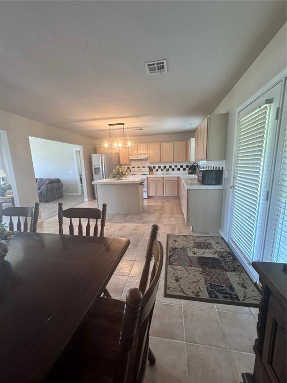 705 Cambridge Dr, Sulphur, OK 73086 - dining area featuring light tile patterned flooring and visible vents