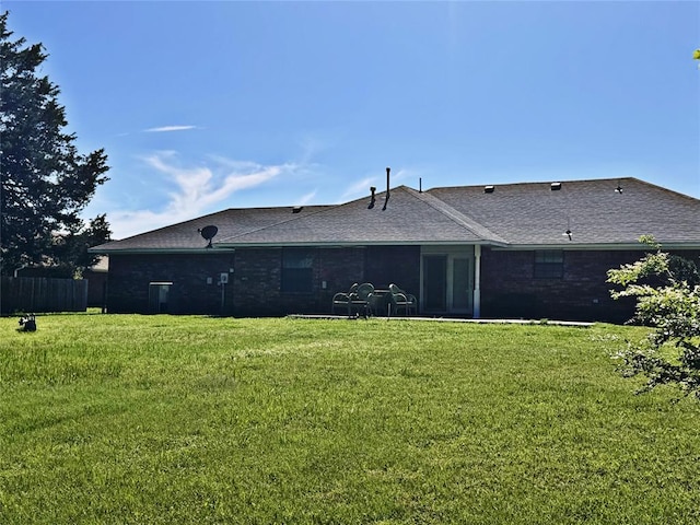 705 Cambridge Dr, Sulphur, OK 73086 - rear view of property with a lawn and roof with shingles