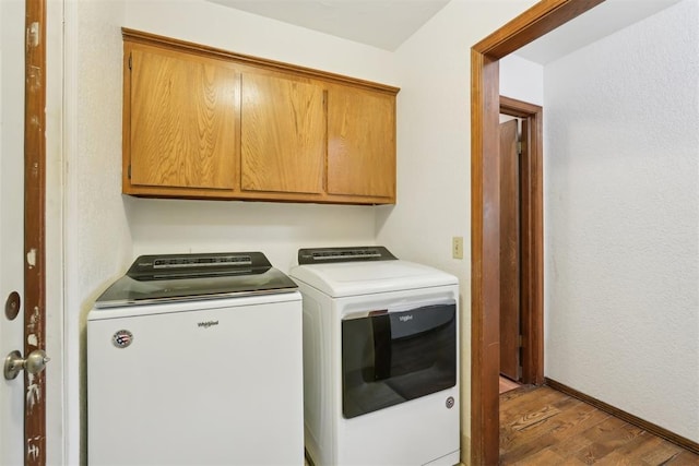 10404 Durham Dr, Oklahoma City, OK 73162 - clothes washing area featuring light wood-style floors, separate washer and dryer, and cabinet space