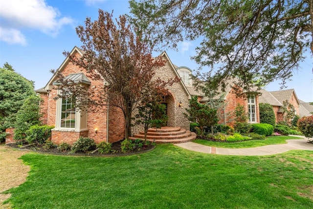 3920 Creek Bank Dr, Edmond, OK 73003 - view of front of house with a front yard and brick siding