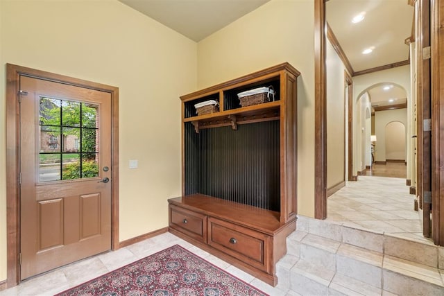3920 Creek Bank Dr, Edmond, OK 73003 - mudroom featuring arched walkways and baseboards