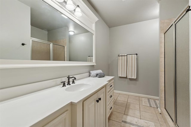 3920 Creek Bank Dr, Edmond, OK 73003 - full bath featuring vanity, a stall shower, and tile patterned floors