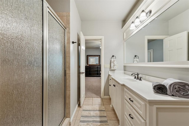 3920 Creek Bank Dr, Edmond, OK 73003 - full bath featuring tile patterned floors, a stall shower, and vanity