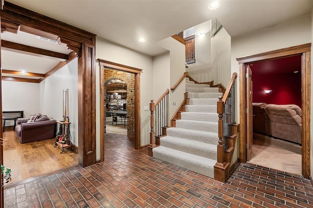 3920 Creek Bank Dr, Edmond, OK 73003 - staircase featuring brick patterned flooring and recessed lighting