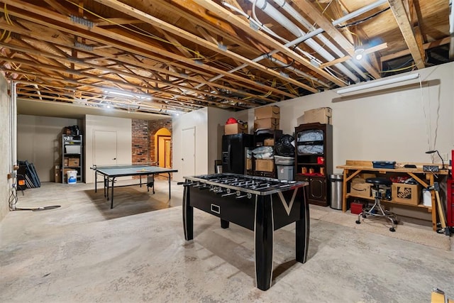 3920 Creek Bank Dr, Edmond, OK 73003 - recreation room with unfinished concrete floors and arched walkways