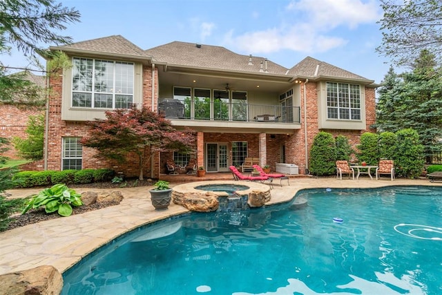 3920 Creek Bank Dr, Edmond, OK 73003 - rear view of house with a balcony, a patio area, brick siding, french doors, and a shingled roof