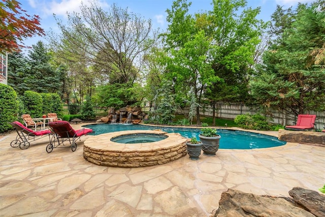 3920 Creek Bank Dr, Edmond, OK 73003 - view of pool featuring a patio area, an in-ground hot tub, a fenced backyard, and view of scattered trees