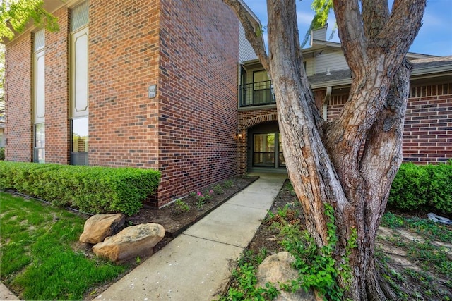 6208 Waterford Blvd Unit 112, Oklahoma City, OK 73118 - view of exterior entry featuring brick siding