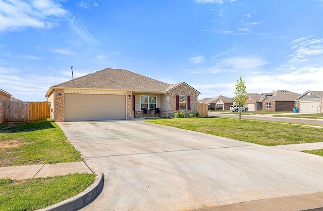 ranch-style house featuring concrete driveway, an attached garage, a front yard, brick siding, and fence