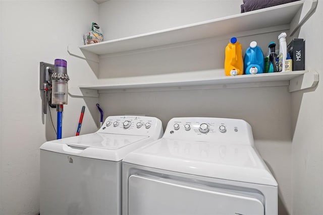 laundry area featuring washing machine and dryer and laundry area