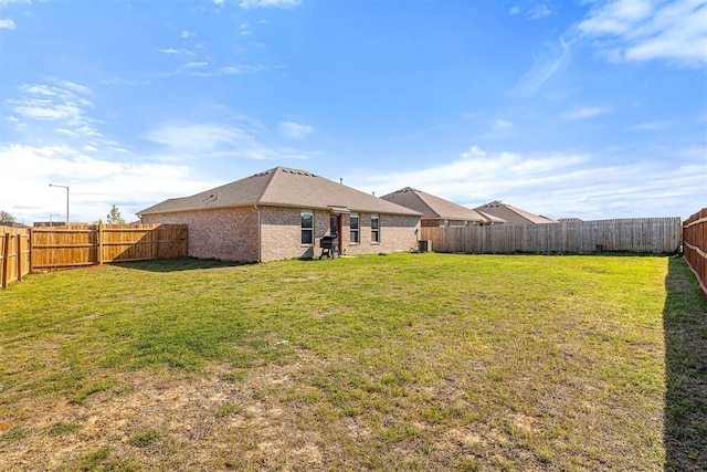 view of yard with a fenced backyard