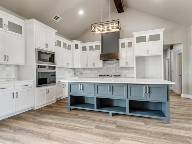 kitchen with visible vents, open shelves, built in microwave, white cabinets, and stainless steel oven