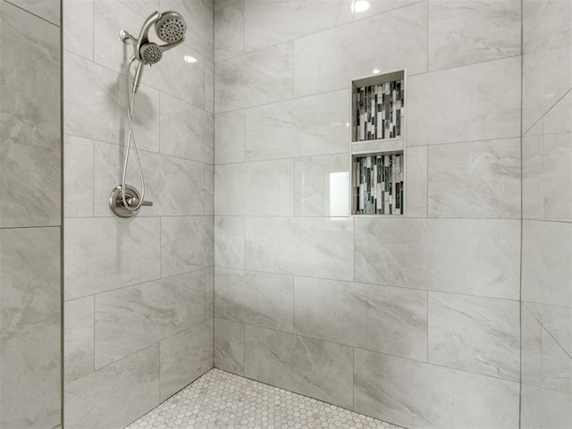 bathroom with tiled shower