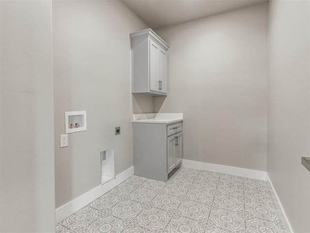washroom featuring baseboards, hookup for a washing machine, cabinet space, light tile patterned floors, and hookup for an electric dryer