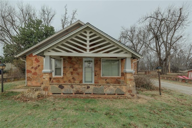 1319 S Division St, Guthrie, OK 73044 - bungalow with stone siding and a front lawn
