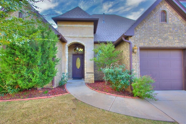 view of front of home featuring a shingled roof, stone siding, brick siding, an attached garage, and concrete driveway