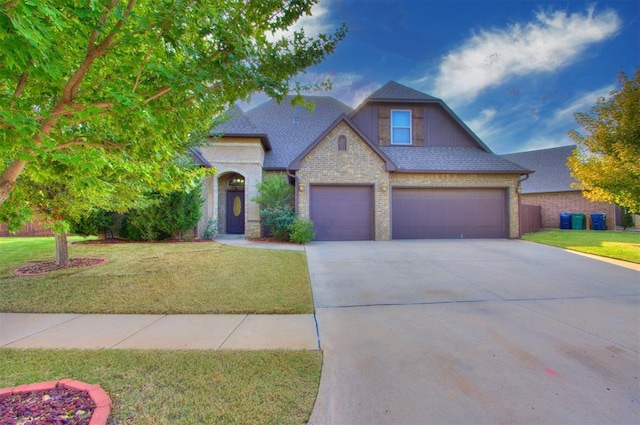 view of front of home featuring concrete driveway, a front yard, brick siding, and a shingled roof