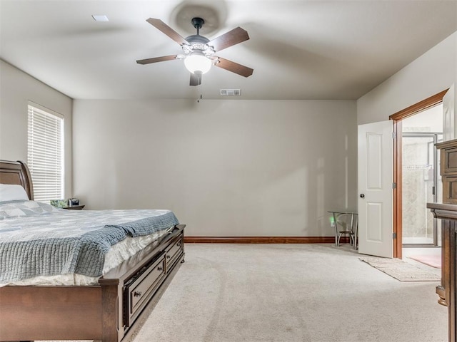 bedroom with light carpet, visible vents, baseboards, and ceiling fan