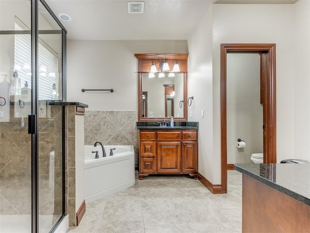 bathroom with a bath, vanity, visible vents, toilet, and a stall shower