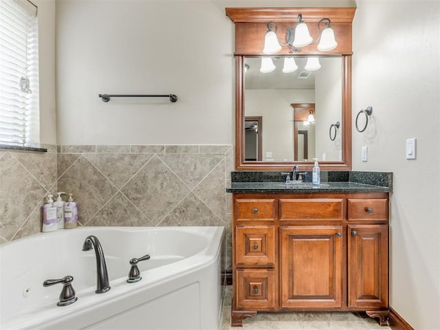 full bathroom featuring vanity, a whirlpool tub, and visible vents