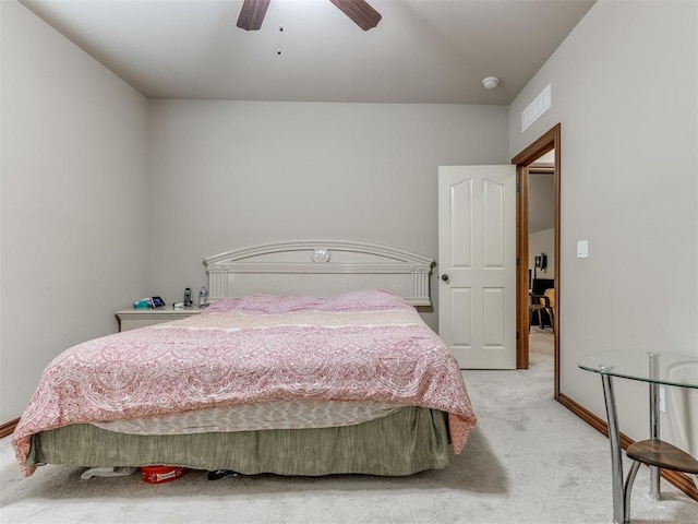 bedroom featuring light carpet, visible vents, baseboards, and ceiling fan