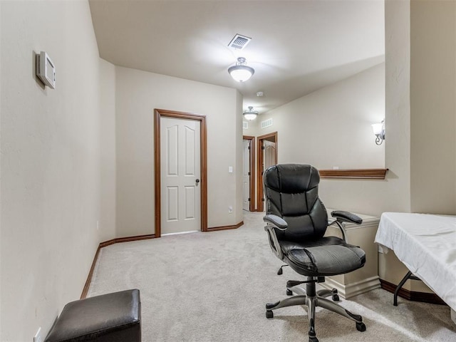 home office featuring visible vents, light colored carpet, and baseboards