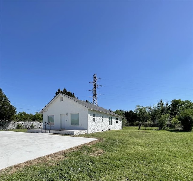 8100 NE 23rd St, Midwest City, OK 73141 - rear view of house featuring a yard and a patio area