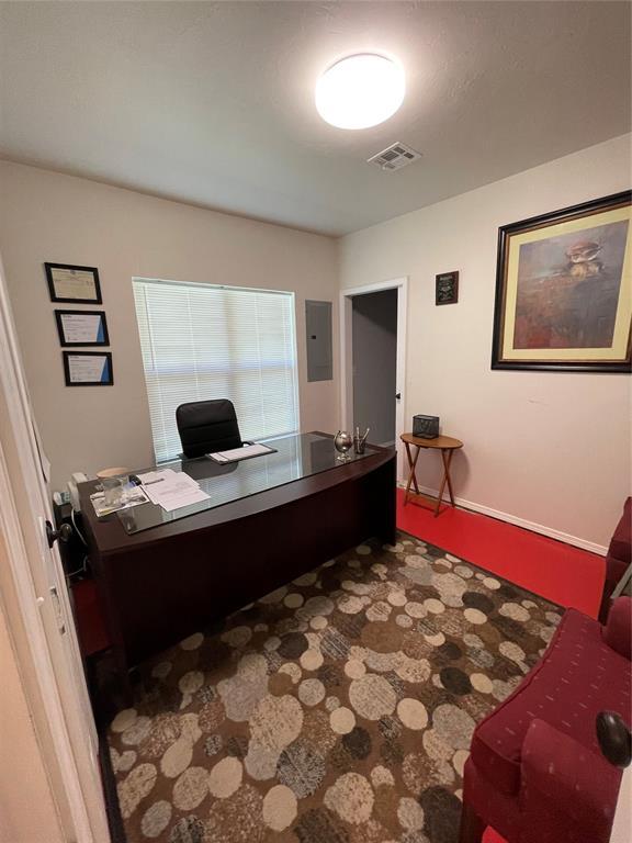 8100 NE 23rd St, Midwest City, OK 73141 - office space with visible vents, baseboards, and electric panel