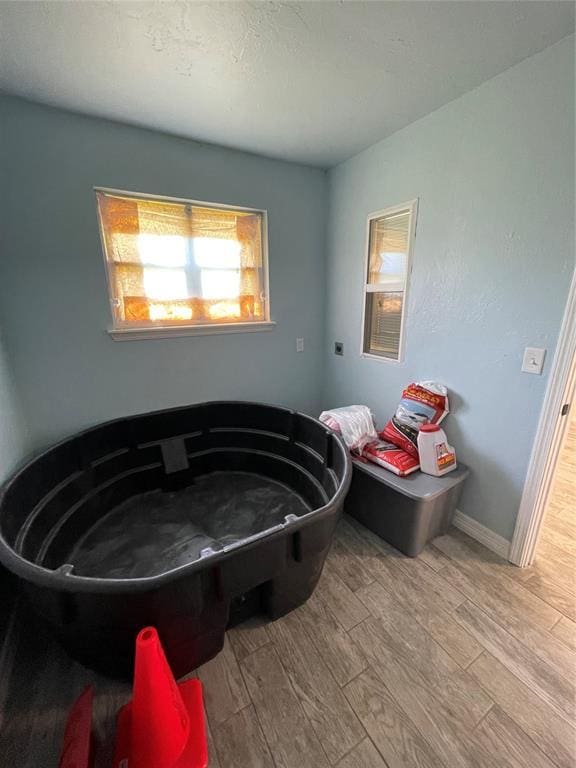 8100 NE 23rd St, Midwest City, OK 73141 - bathroom featuring baseboards and wood finished floors