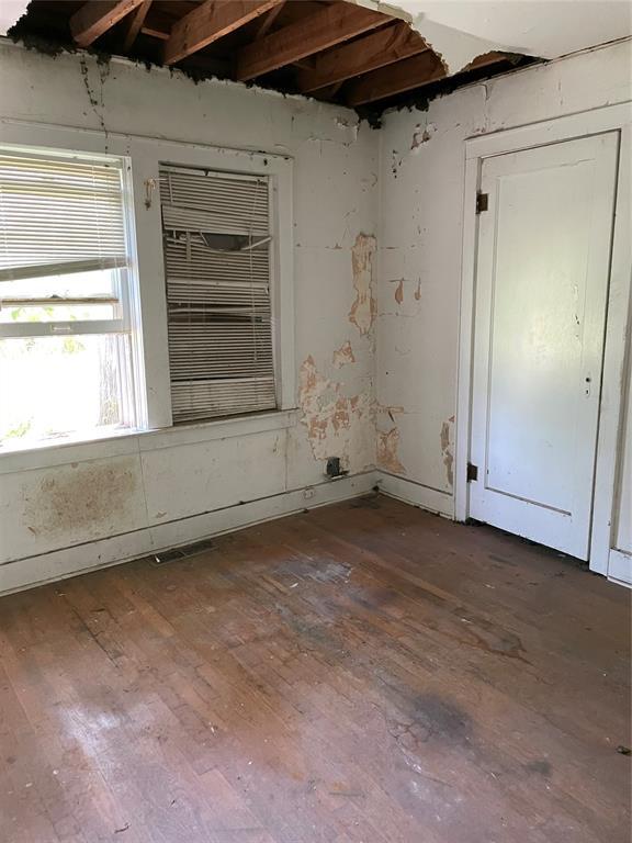 8100 NE 23rd St, Midwest City, OK 73141 - unfurnished room with hardwood / wood-style floors