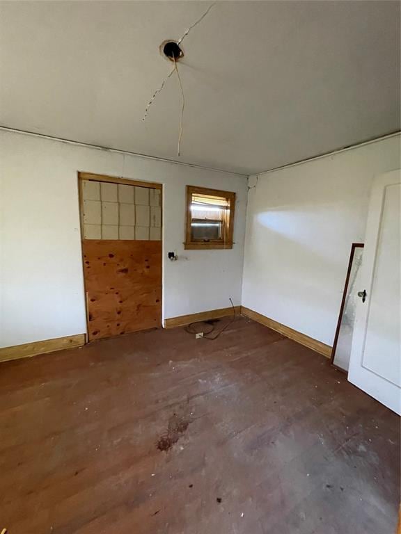 8100 NE 23rd St, Midwest City, OK 73141 - spare room featuring baseboards