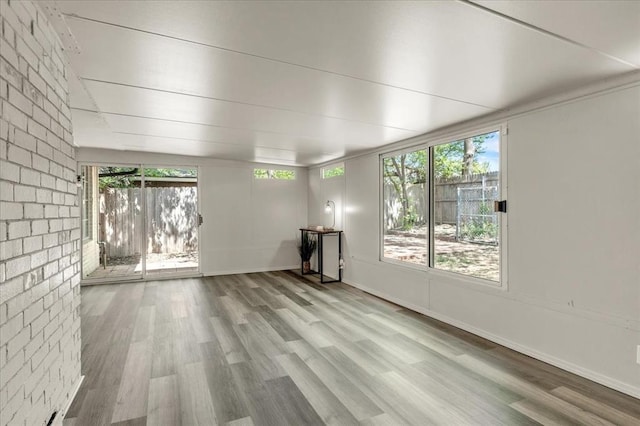 10908 Bel Air Pl, Oklahoma City, OK 73120 - unfurnished living room featuring baseboards and wood finished floors