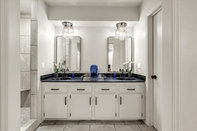 10908 Bel Air Pl, Oklahoma City, OK 73120 - full bathroom with double vanity, tile patterned floors, tiled shower, and a sink