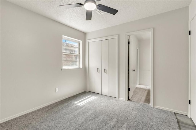 10908 Bel Air Pl, Oklahoma City, OK 73120 - unfurnished bedroom with carpet flooring, a textured ceiling, visible vents, a ceiling fan, and a closet
