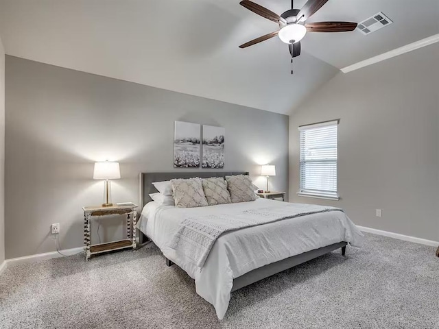 carpeted bedroom featuring vaulted ceiling, visible vents, baseboards, and ceiling fan