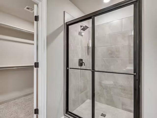 full bath featuring visible vents and a stall shower