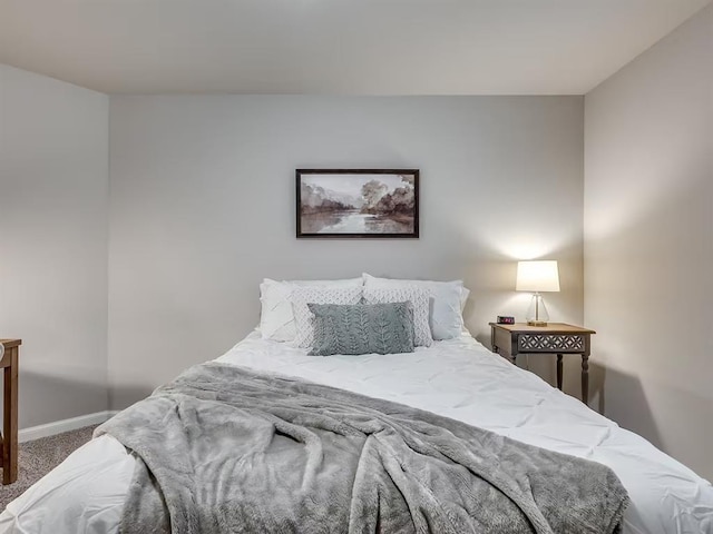 carpeted bedroom with baseboards