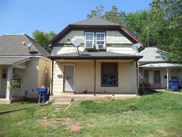 708 E Harrison Ave, Guthrie, OK 73044 - view of front of home featuring a front lawn and covered porch
