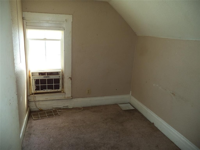 708 E Harrison Ave, Guthrie, OK 73044 - bonus room featuring lofted ceiling, carpet flooring, cooling unit, and baseboards